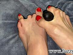 Intense close-up of Russian teen's red pedicure and footjob