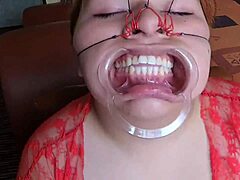 Chubby Latina slave gets face fucked and cummed on in bukkake scene