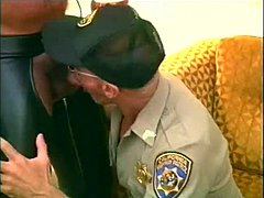 A muscular bear in leather chaps gets his cock sucked by a police officer