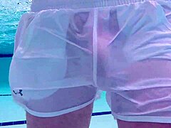Underwater crossdressing and swimming with a poolboy's big cock