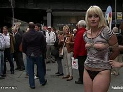 Bound blonde submits to public humiliation and assplay