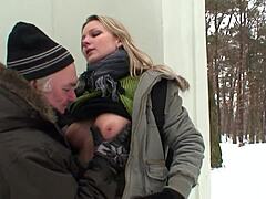 Young blonde has orgasm on snowy ground during intimate encounter with stepfather