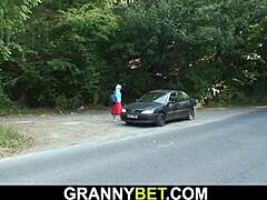 Sexy granny plays outdoor sex games