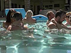 Four transsexuals engage in bareback anal and handjob action at pool party