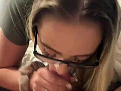 A blonde with glasses gives a hard core blowjob and gets a facial